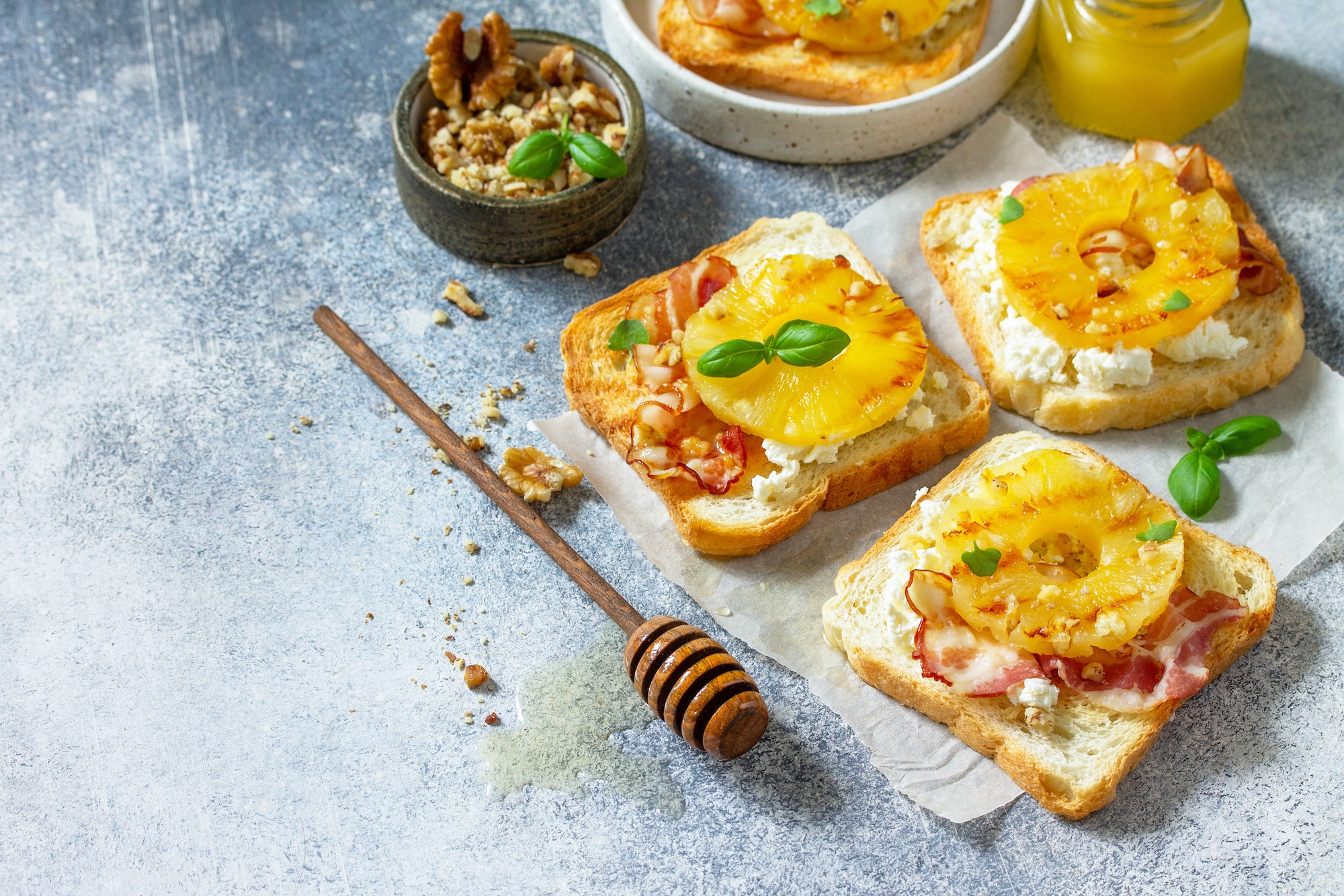 Healthy breakfast or snacks. Toast with caramelized pineapple, bacon, nuts, and ricotta.